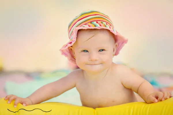 Cheerful little baby girl with Downs Syndrome playing in the pool — Stock Photo, Image