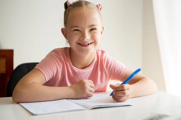 Girl Syndrome Does Her Homework Home Prepares Her Hand Writing — Zdjęcie stockowe