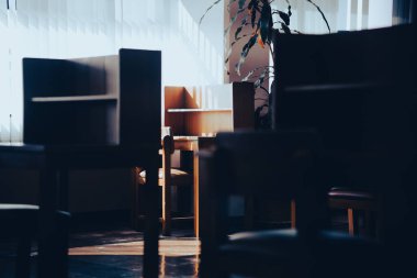 wooden table chair for reading in library interior