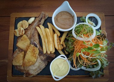 vegetable salad with grilled pork chop steak