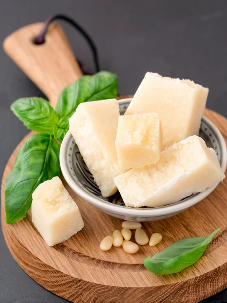 Parmesan cheese and basil leaves — Stock Photo, Image