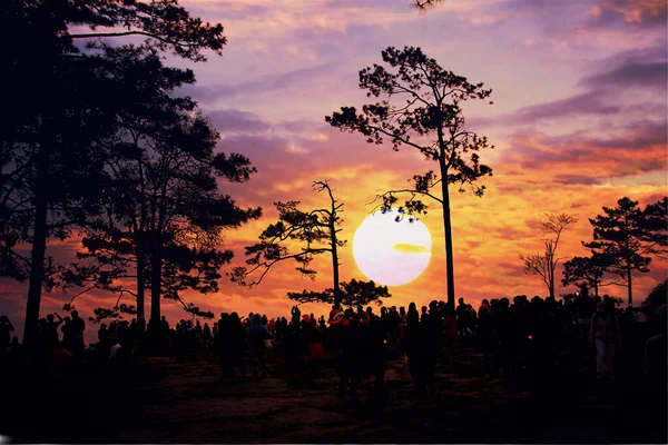 group of tourist looking sun set multicolor sky at view point in  PHU KRADUENG National park  LOI province