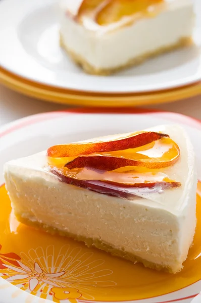 Tasty cheesecakes with peach — Stock Photo, Image
