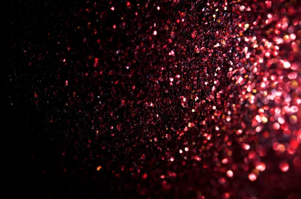 Ofokuserat abstrakt rött glitter bakgrund — Stockfoto