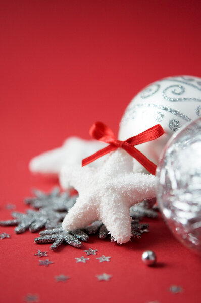 Bright xmas ornaments on red holiday background