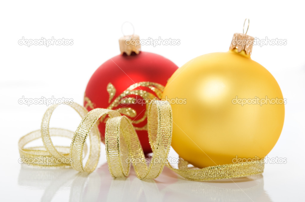 Red and golden xmas (christmas) ornaments on white background