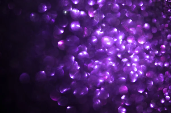 Unfocused abstract purple glitter holiday background — Stock Photo, Image