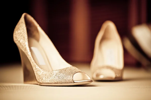 Golden shoes Royalty Free Stock Images