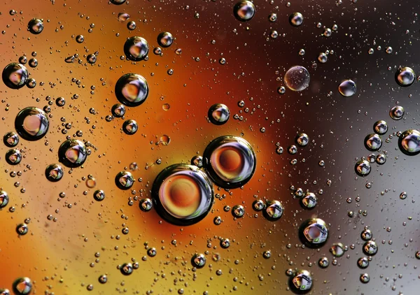 Gotas de aceite en el agua . —  Fotos de Stock