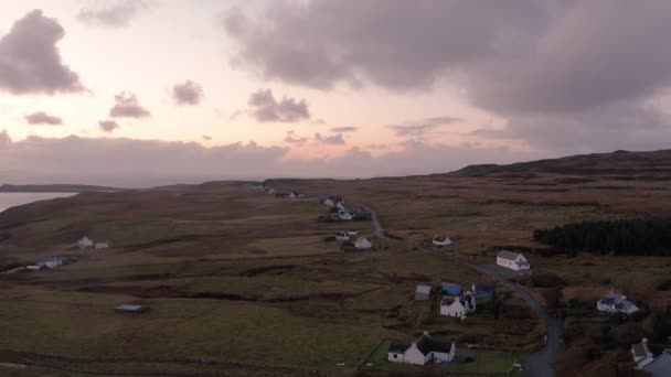 Stunning views of the Isle of Skye coast with low clouds and pink sunset — Stockvideo