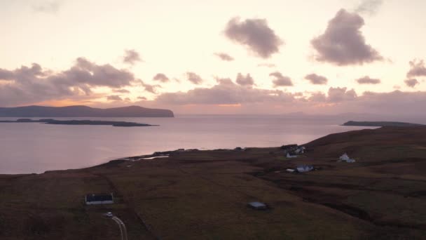 Stunning views of the Isle of Skye coast with low clouds and pink sunset — 图库视频影像