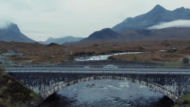 Sligachan Old Bridge and river, aerial drone footage early morning on foggy day — Stockvideo