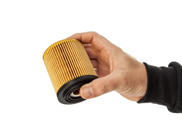 Mão masculina segurando um filtro de óleo automático — Fotografia de Stock