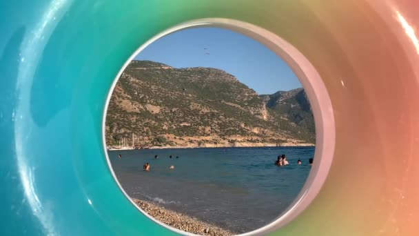 Swimming Sea Overlooking Inflatable Ring Summer Sea Coast Backdrop Mountains — Stock Video