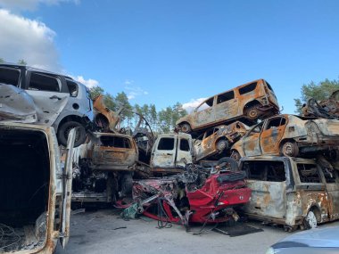 Burnt and blown up car. Cars damaged after shelling. Traces of shots on the body of the car. War between Russia and Ukraine, Irpin-Bucha, April 10, 2022