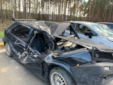 Burnt and blown up car. Cars damaged after shelling. Traces of shots on the body of the car. War between Russia and Ukraine, Irpin-Bucha, April 10, 2022
