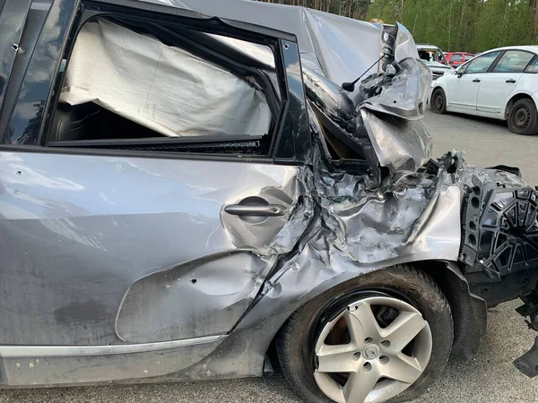 Burnt and blown up car. Cars damaged after shelling. Traces of shots on the body of the car. War between Russia and Ukraine, Irpin-Bucha, April 10, 2022