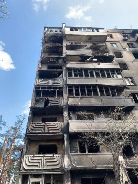 The ruins of multi-storey buildings after the shelling. Burnt houses due to explosions. The house was damaged by bombs and aircraft. War between Russia and Ukraine, Irpin-Bucha, April 10, 2022