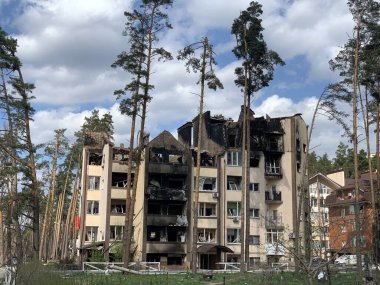 The ruins of multi-storey buildings after the shelling. Burnt houses due to explosions. The house was damaged by bombs and aircraft. War between Russia and Ukraine, Irpin-Bucha, April 10, 2022