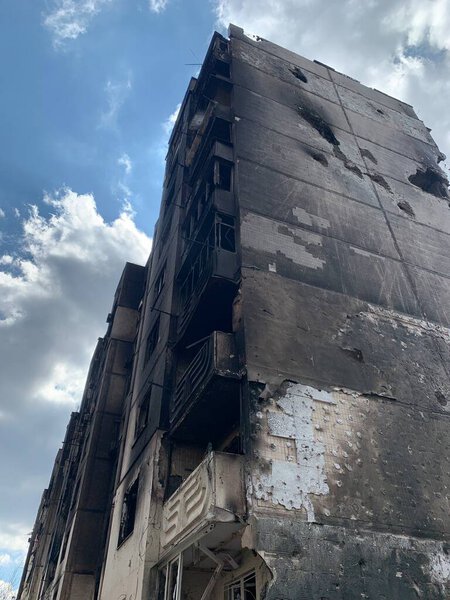 The ruins of multi-storey buildings after the shelling. Burnt houses due to explosions. The house was damaged by bombs and aircraft. War between Russia and Ukraine, Irpin-Bucha, April 10, 2022