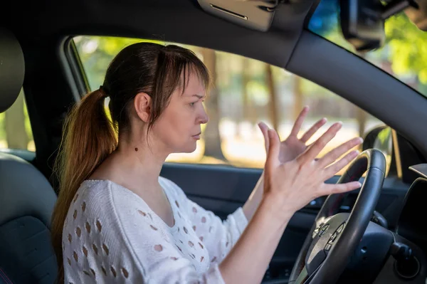 woman resent driving after a car accident. woman driving a car.