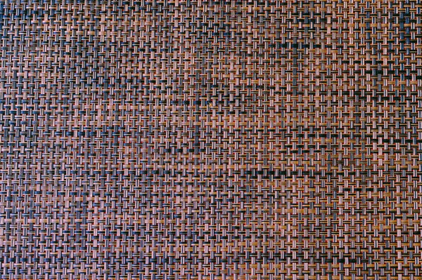 Grafik tasarımı için Wicker mat arkaplanı. Kumaş dokusu arkaplanının yakın plan ayrıntıları.