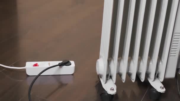 Woman Turns Electric Oil Heater Cold Weather Bad Weather — Vídeo de Stock