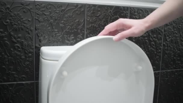Woman Closes Toilet Lid Flushes Water Toilet Close — 图库视频影像