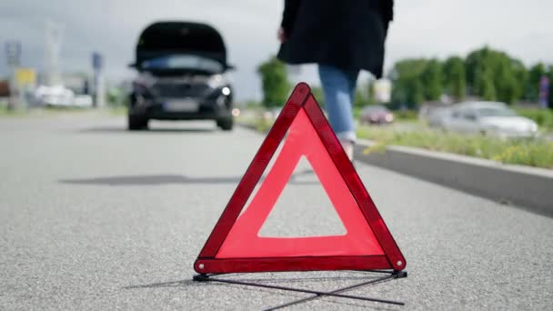 Red Warning Triangle Woman Walking Her Broken Car Road — 图库视频影像