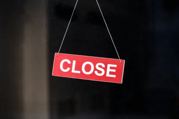 Stores are closing due to financial difficulties and the economic crisis. A sign that says \