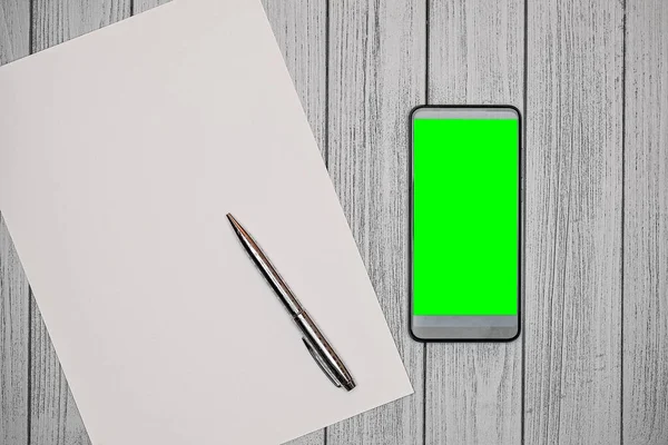 Top View Phone Green Screen Next Pencil Note Paper Table — Stock Photo, Image