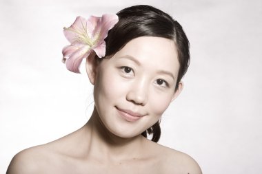 güzel bir cilt ile bir Asyalı kız