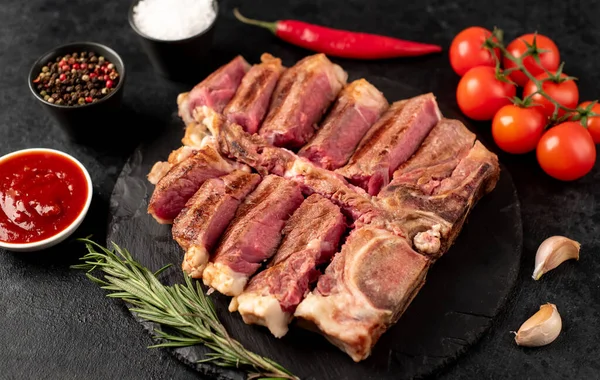 Grilled Sliced Bone Steak Black Stone Slate — Stock Photo, Image