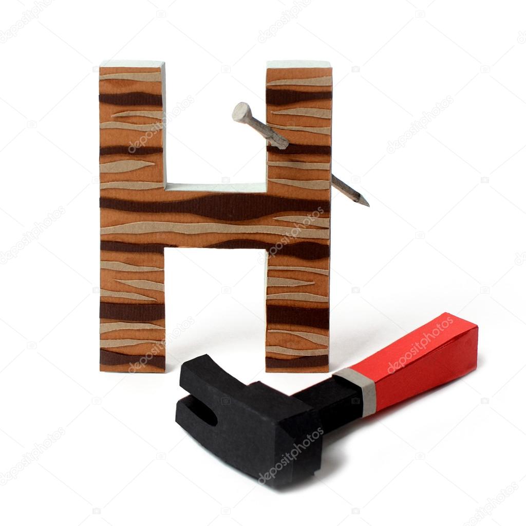 Paper hammer and H letter — Stock Photo © AnnDoronina29 26398945