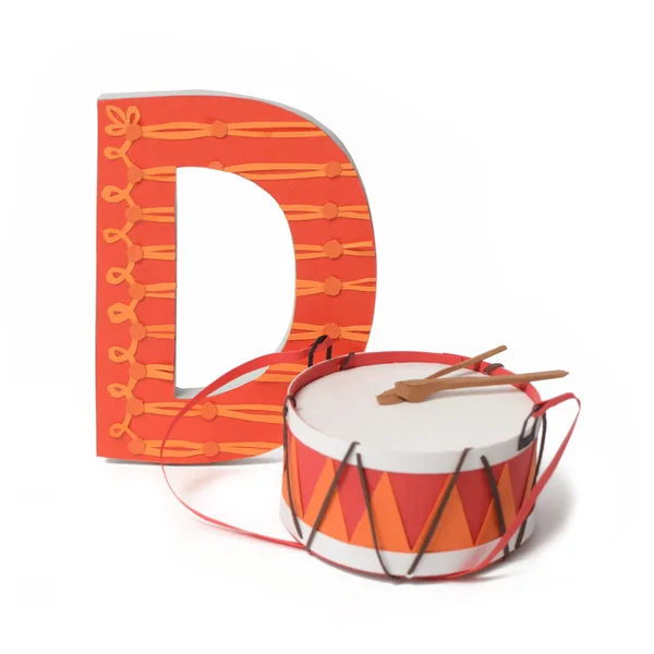 Paper drum and the letter D — Stock Photo, Image