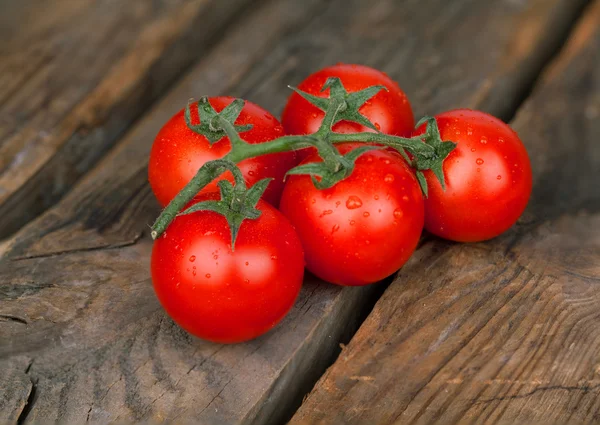 Cherry tomatoes on table — Stock Photo, Image