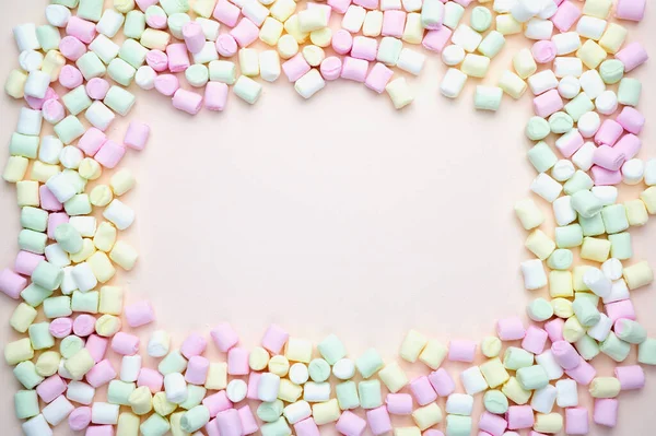 Frame laid with marshmallows in pastel colors — Stock Photo, Image