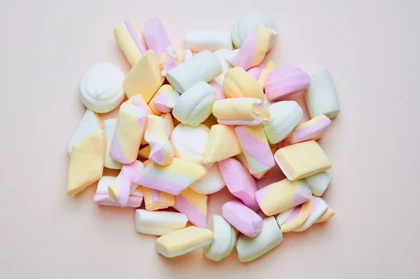 Pastel colored marshmallows on a pink background — Stock Photo, Image