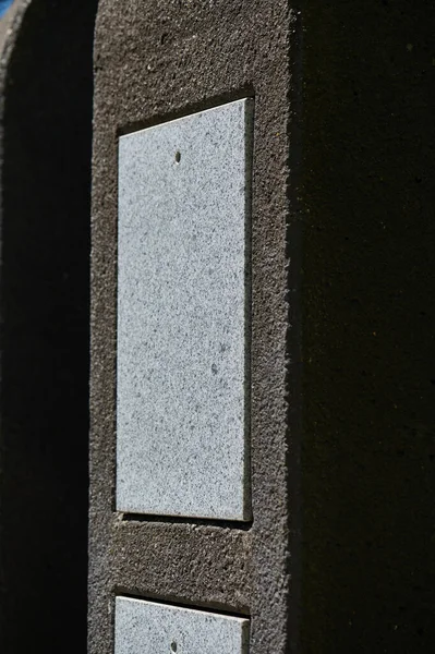 Close up of empty urn grave in cemetery