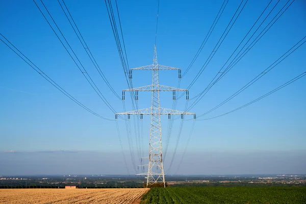 power pole in a field in front of the blue sky in Germany with copy space