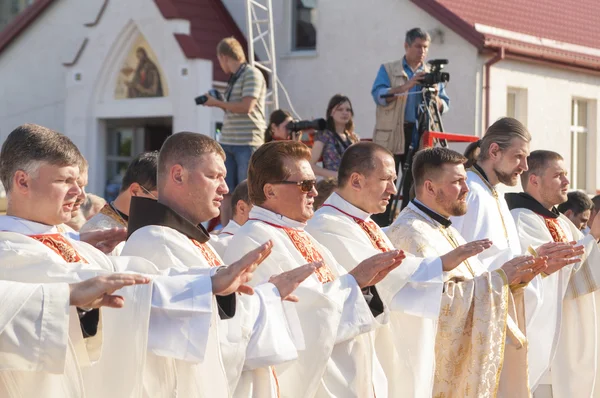 Catholic Bishop praying on Minsk Catholic church opening prior Roman Cardinal Tarcisio Bertone arrival