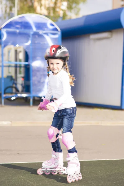 girl in protective helmet skating