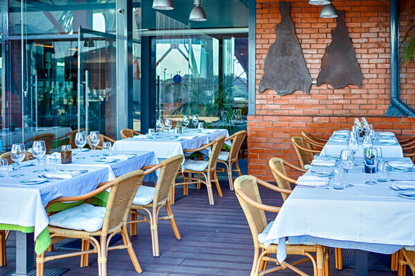 Comfortable Relaxing Open Restaurant In Port of Lisbon in Portugal. Horizontal Image Composition