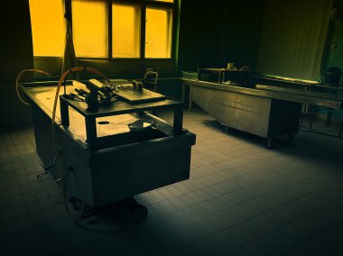 an autopsy room interior low light clipart