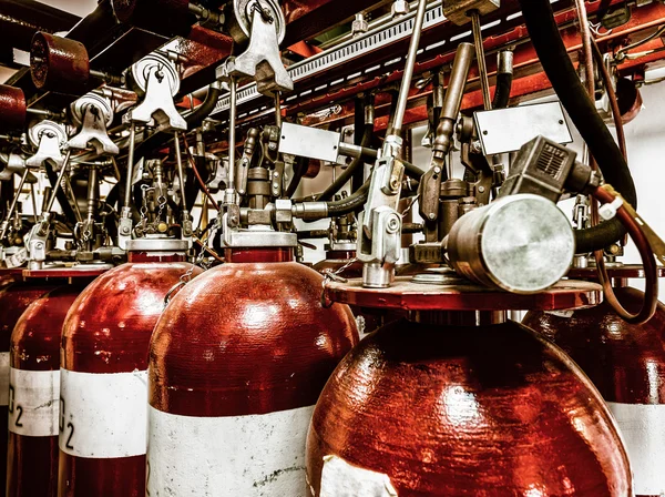 Large CO fire extinguishers in industrial interior — Stock Photo, Image
