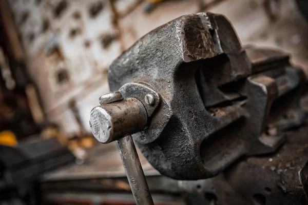 Old iron clamp in industrial interior — Stock Photo, Image