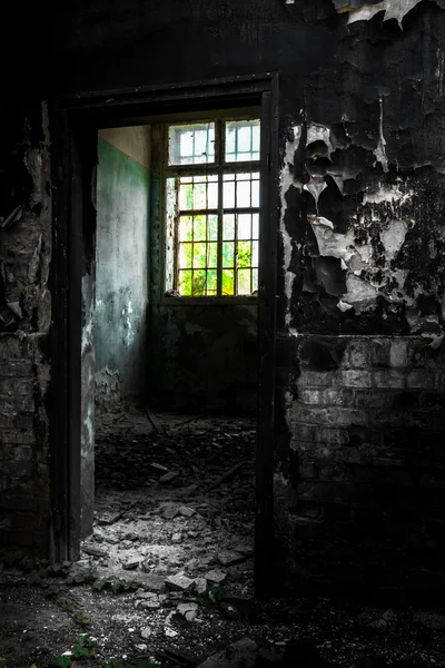 Door in a desolate industrial building — Stock Photo, Image