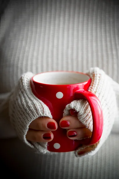 Female hands with coffee drink