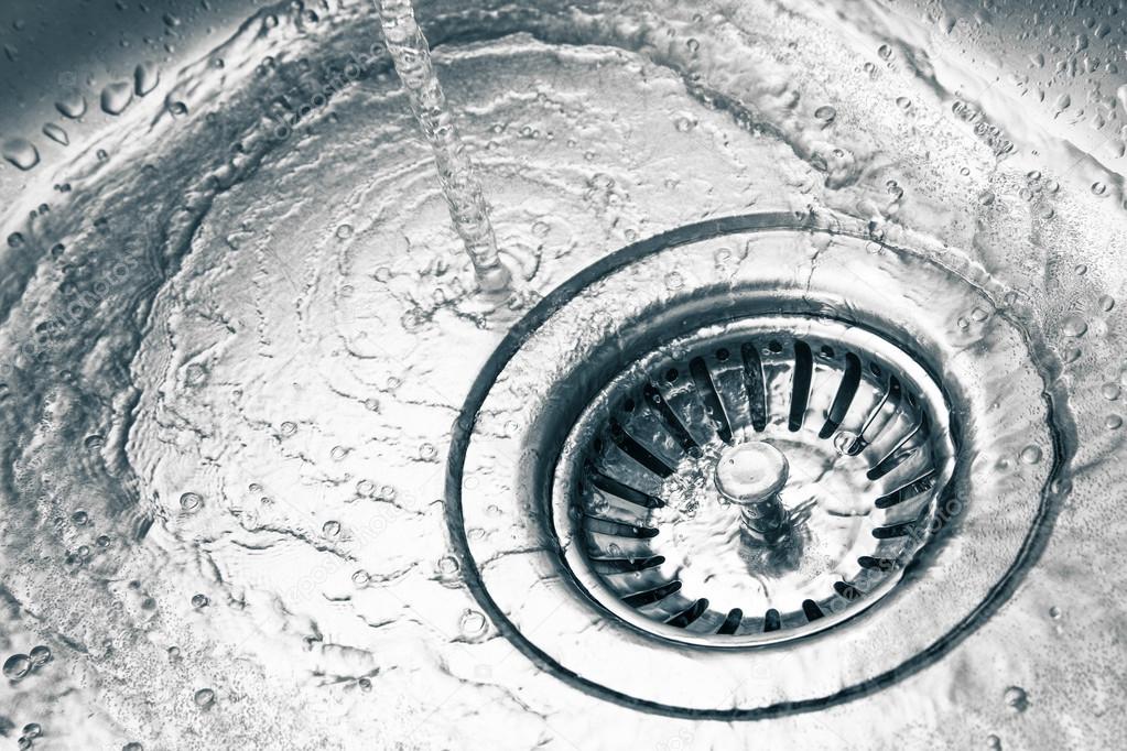 A stainless steel kitchen sink drain Stock Photo by ©maroti 41276639