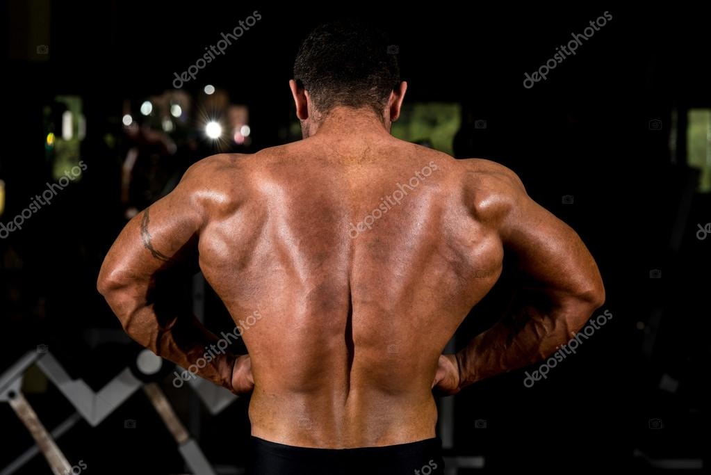 Muscular bodybuilder showing back lat spread — Stock Photo © ibrak